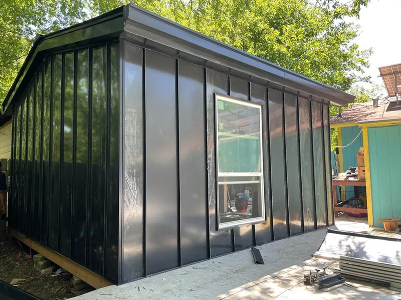 Black standing seam metal wall panels for Roof Inspection in Lansing