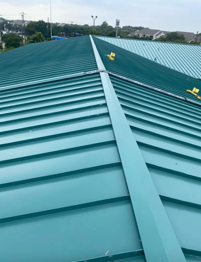 Green commercial metal roof ridge and valley for Metal Roof Repair in Lansing
