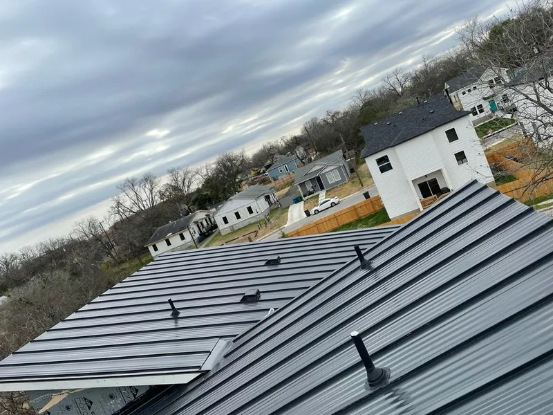 Standing seam metal roof panels with vents for Skylight Repair in Lansing